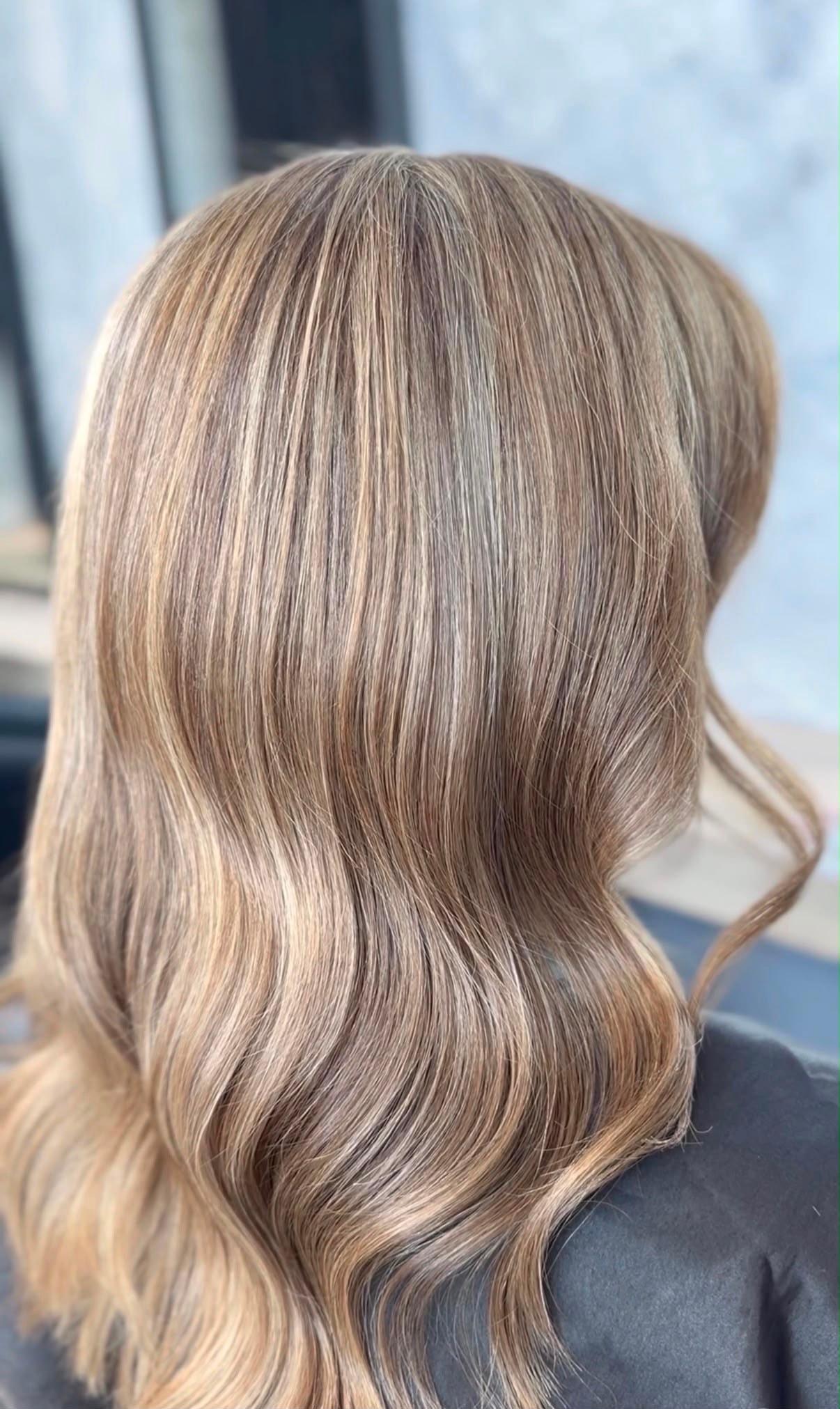 Ashy pale-blonde waves, back view