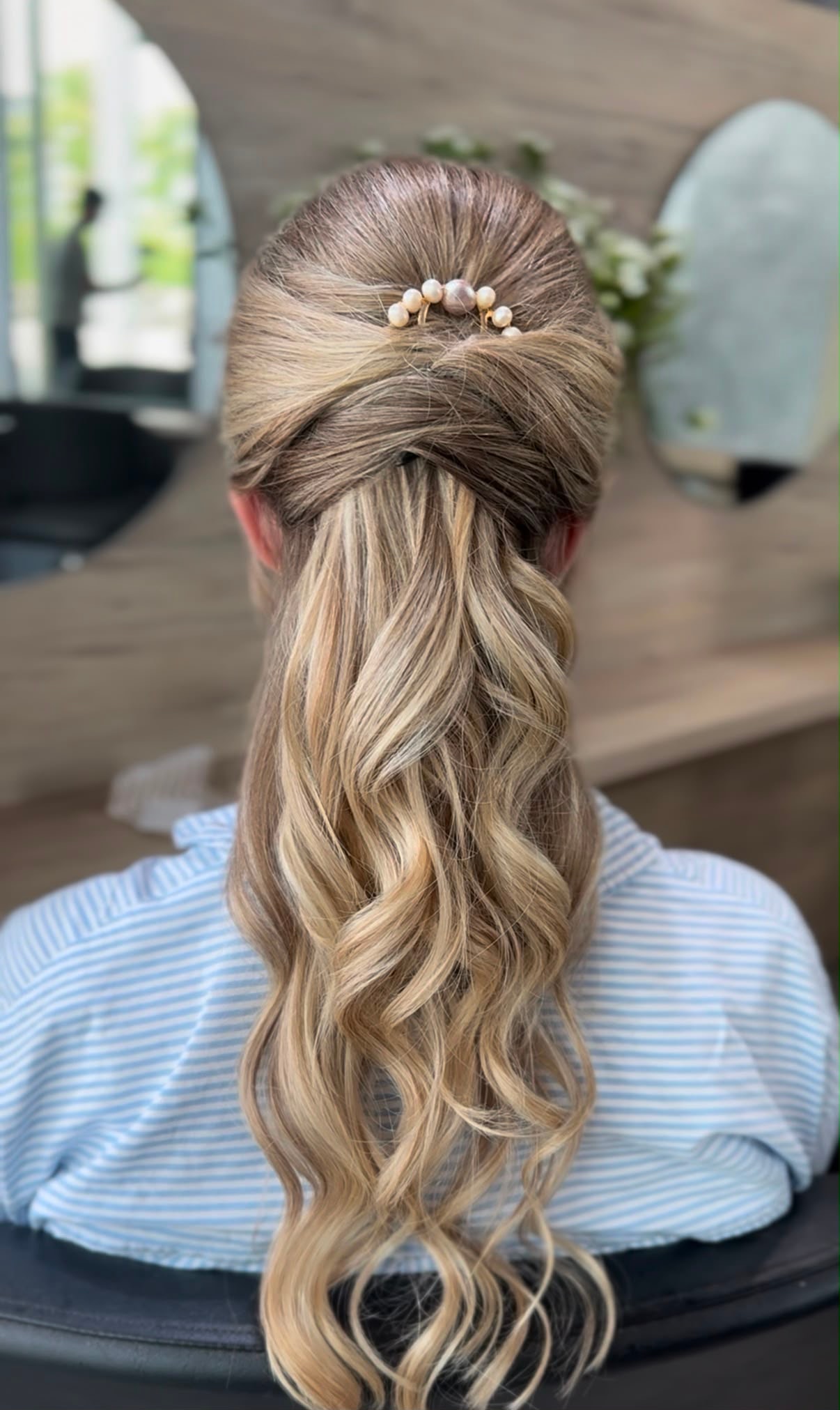 Half-up occasion style with a pearl clip
